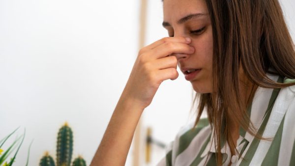 Woman suffering from a deviated septum