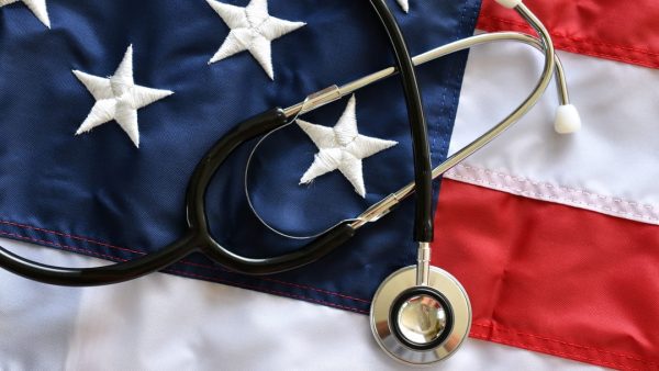 A stethoscope on top of an American flag.
