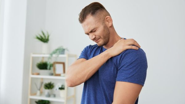 Man suffering from shoulder bursitis.