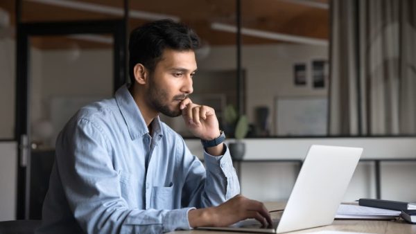 MAN WRITING A VA BUDDY LETTER.